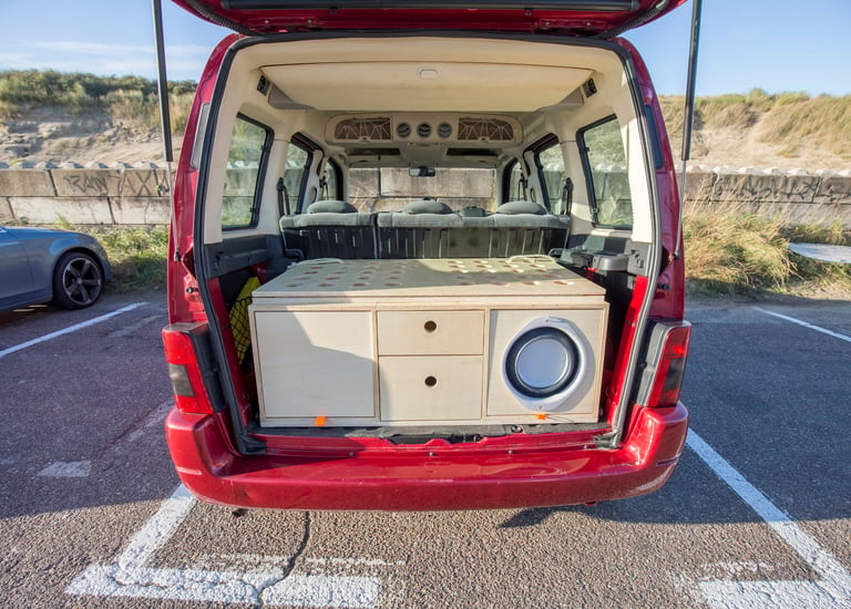 2nd prototype WOODSYBOX with drawers and speaker installed in a red minivan.
