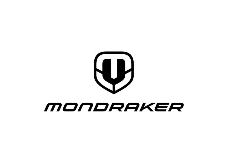 Mondraker mountain bike brand logo featuring a black shield emblem and bold typography on a white background.