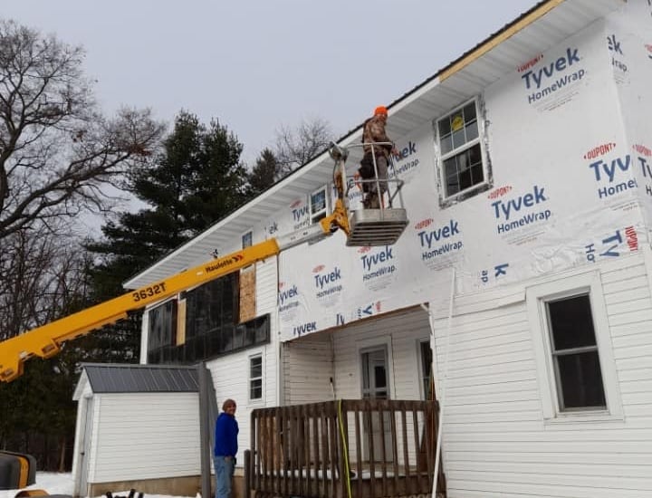 AG's General Contractor finishing up sidings for a home