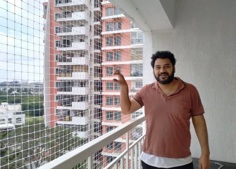 securely installed on a balcony railing with a balcony safety and pigeon nets