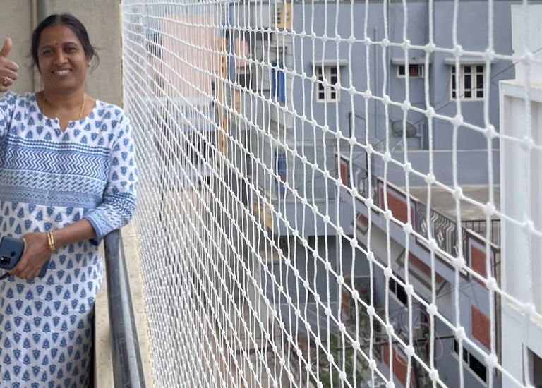 Finished pigeon net installation blending with building architecture.