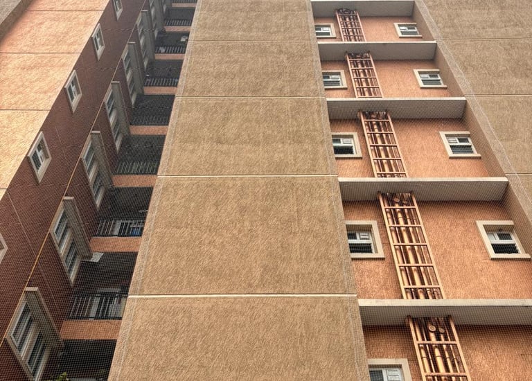 multiple apartment balconies in Wadala fitted with pigeon nets.