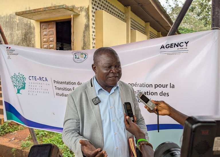A Central African Republic official gives a press interview for CTE-RCA regarding ecological transition.