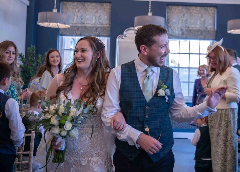 bride and groom walking down the aisle