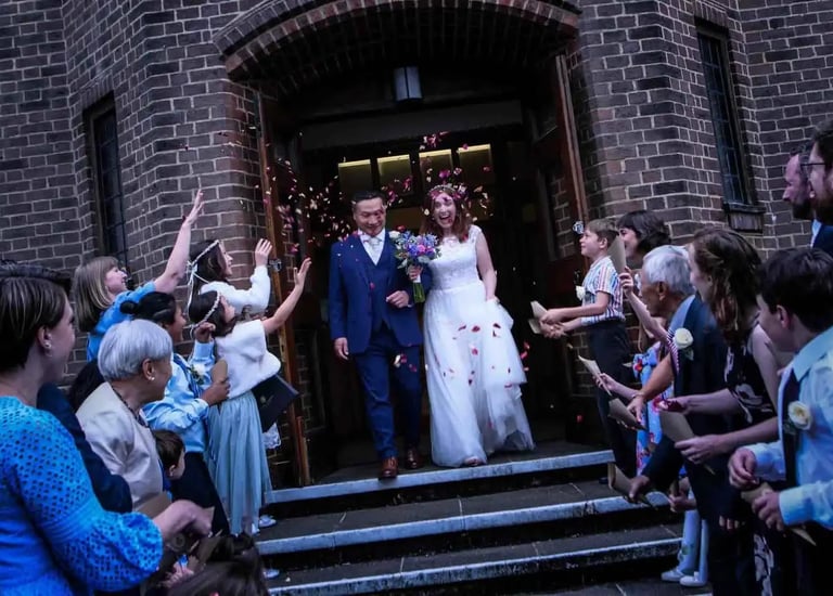 wedding couple leaving the church