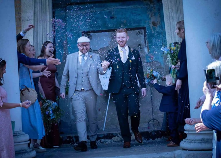 Newly-weds having their confetti moment