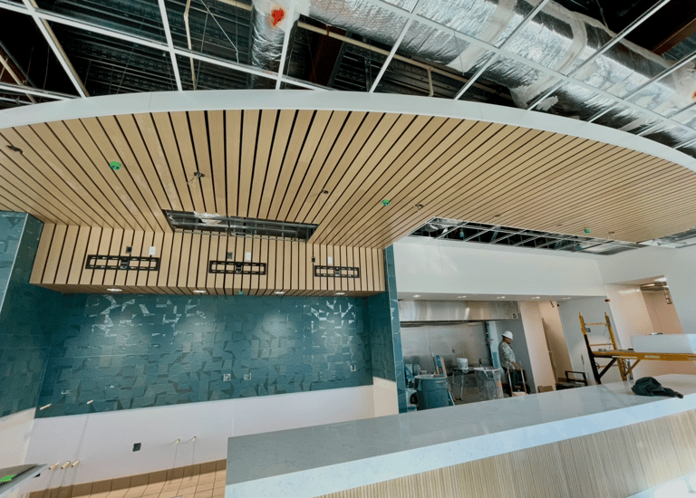 Luxury curved wood ceiling system and custom wood paneling installation in Florida