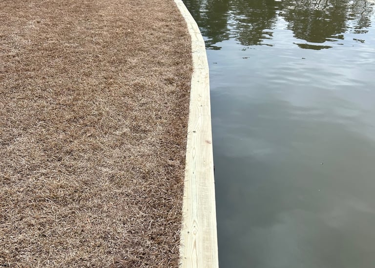Ground contact pressure treated sea wall