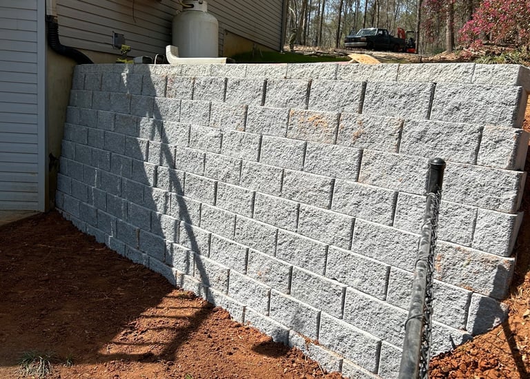 Retaining wall holding back soil. Block- Belguard Diamond Pro 8x8x16