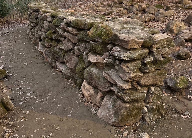 Natural stone wall with moss for a weathered finish