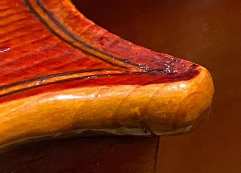 Jim Clinton Cello 2024 close-up of corner and edge detail