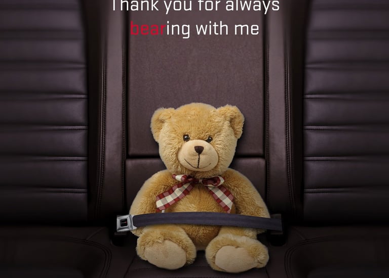 Teddy bear buckled into a leather Dodge car seat for a Happy Mother's Day message.