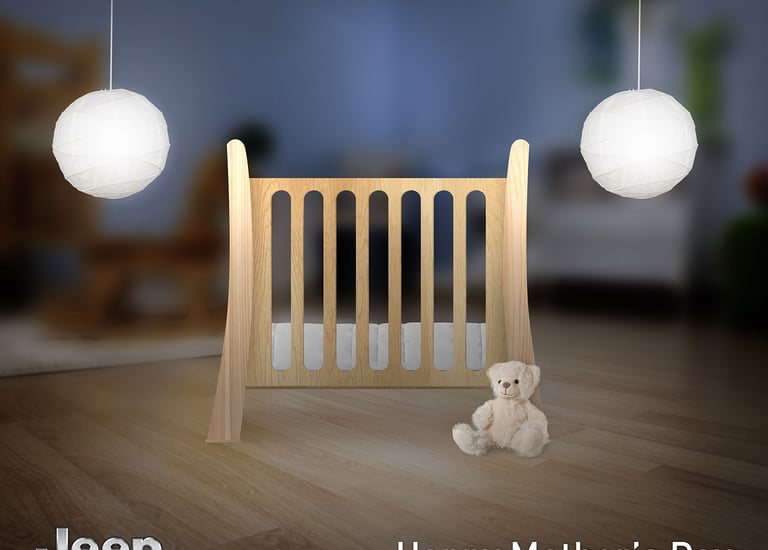 A modern wooden baby crib with a white teddy bear and pendant lights for a Jeep Mother's Day advertisement.
