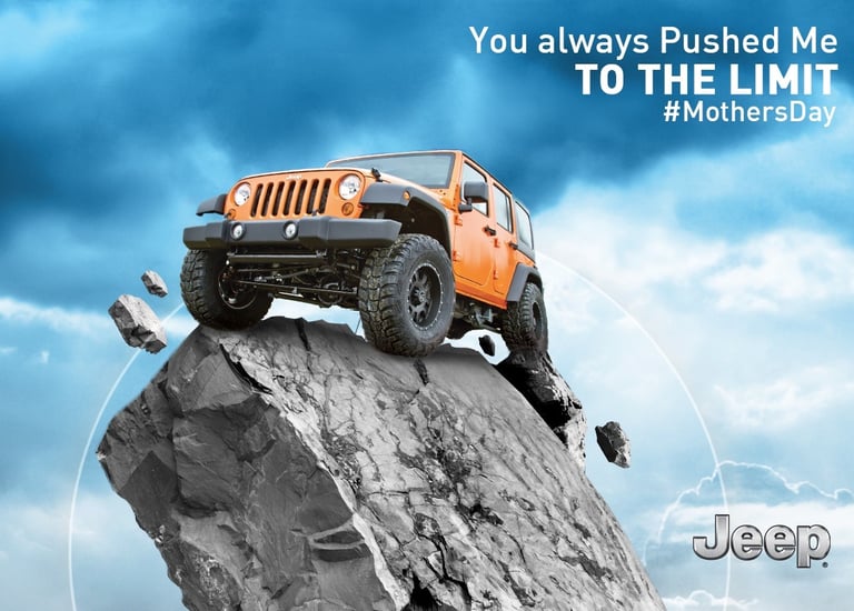 Jeep Wrangler climbing a steep rocky cliff under a dramatic sky with Mother's Day message 'You alway