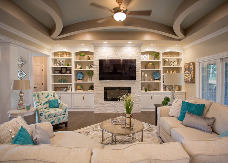 Cozy custom living room with fireplace and built-in shelves in Kane County home