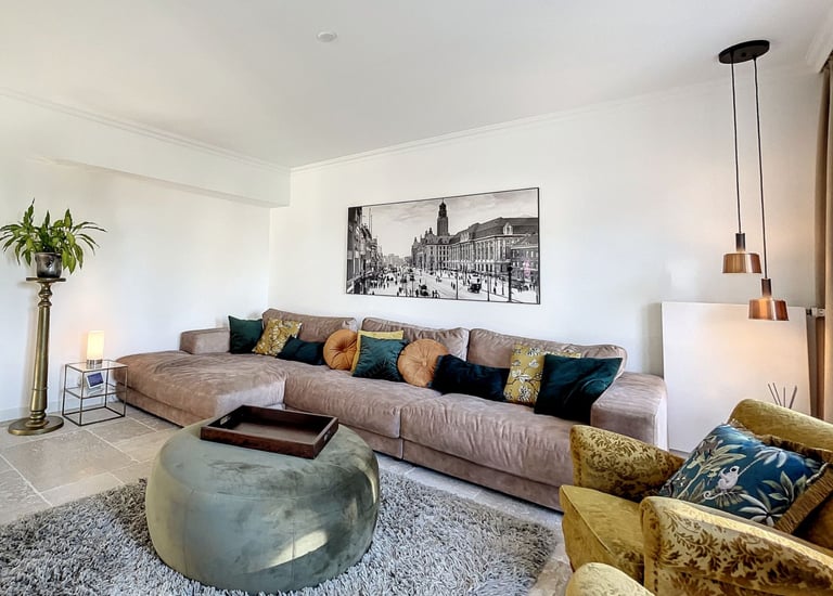 cozy living room with neutral sofa, warm tones and natural materials