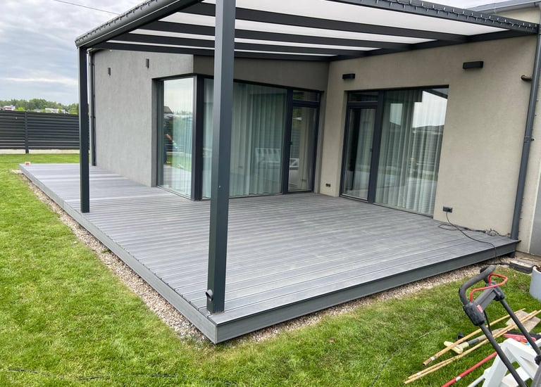 a patio with a deck and a lawn chair