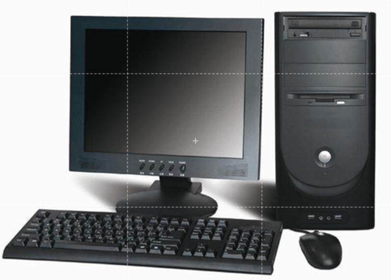 An old computer desktop with a monitor, keyboard, and mouse