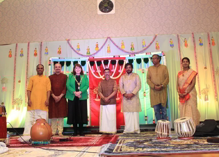 A picture of Rugby mayor felicitating the artists