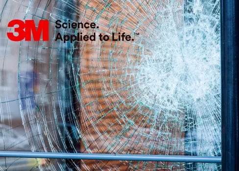a smashed glass window with a smashed glass in the window