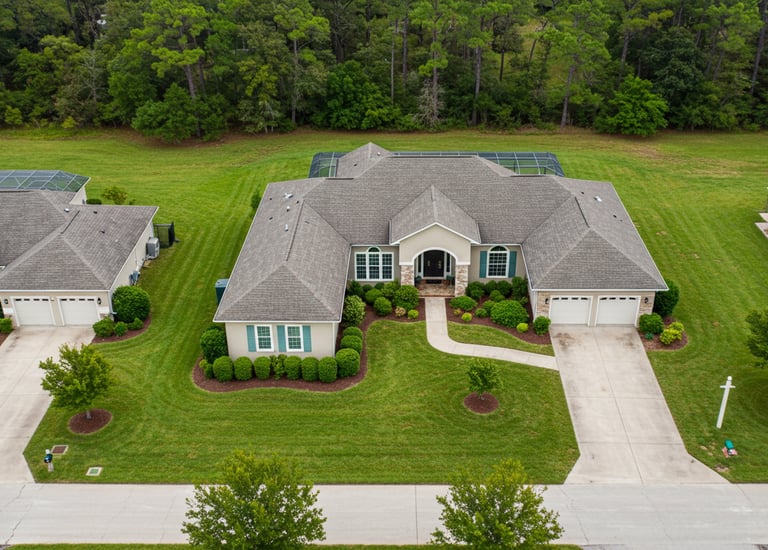 a large house with a tennis court and tennis court