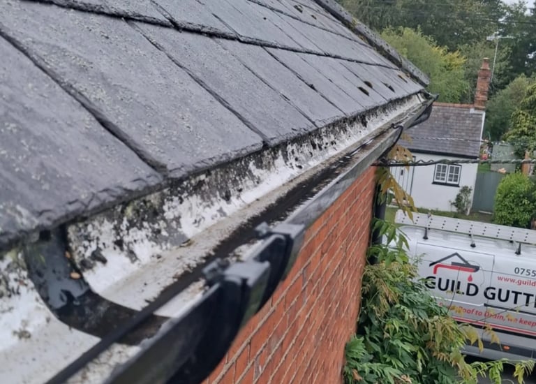 Gutter clearance and debris removal on residential property