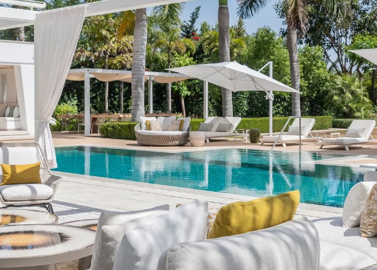 Luxury pool terrace with shaded lounges at Villa Serenity