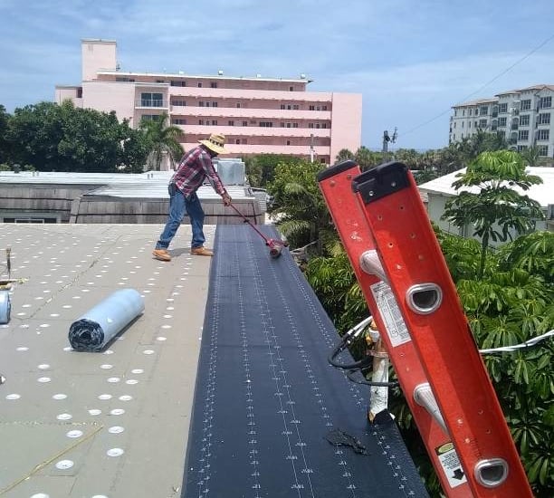 working on a commercial built up tapered flat roof.