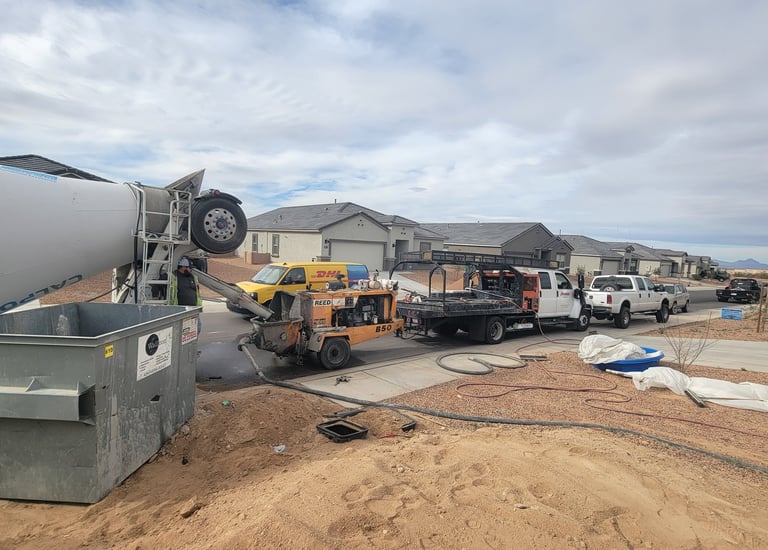 a cement mixer truck is parked in a lot