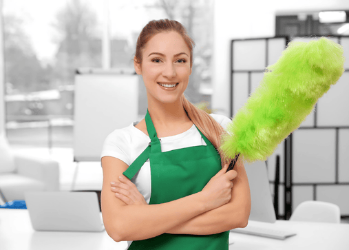 a woman in green aprons holding a green duster