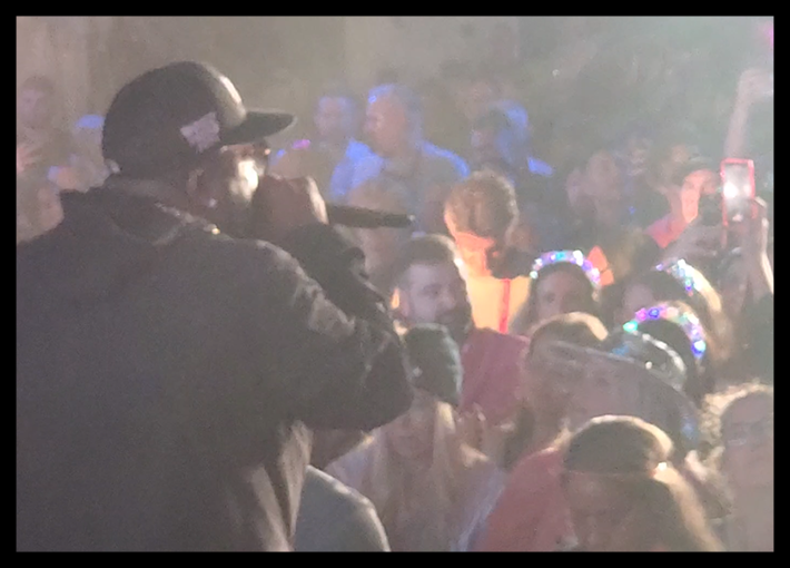 Hip hop artist entertains the crowd at an outdoor event. Planned, managed, and executed by Comprehensive Creations team.