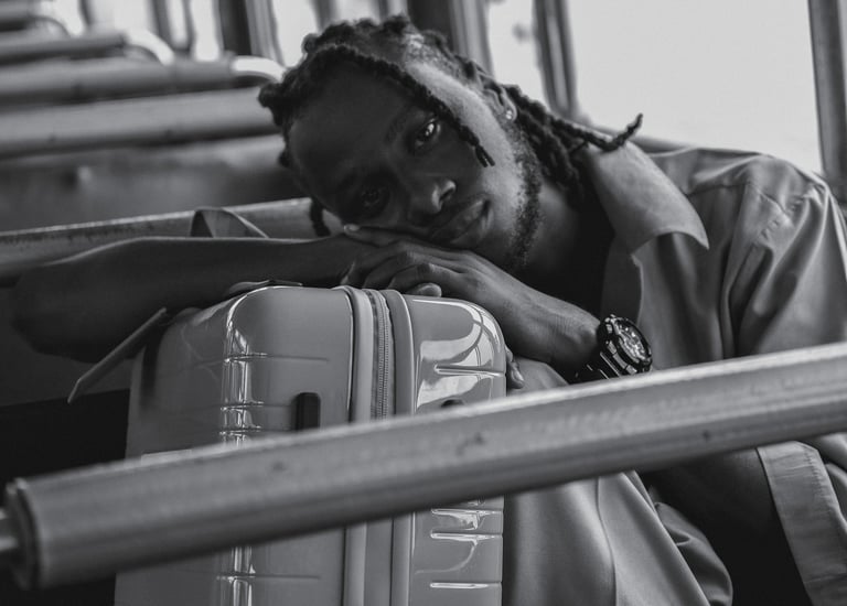 a man with dreadlocks sitting on a bus