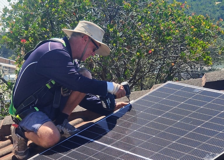 a man installing a solar panel