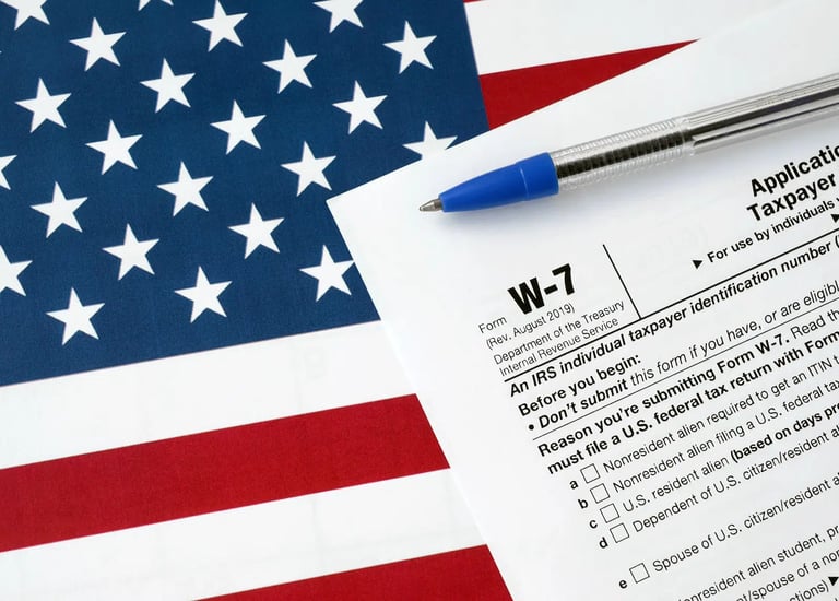 a pen. W-7. Itin number. Taxes. Accounting. ITIN Number in USA