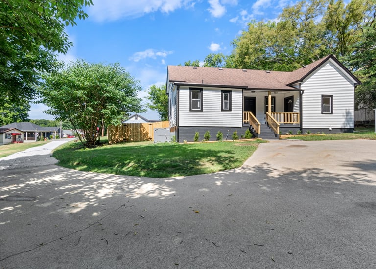 a house with a driveway and a driveway with a driveway