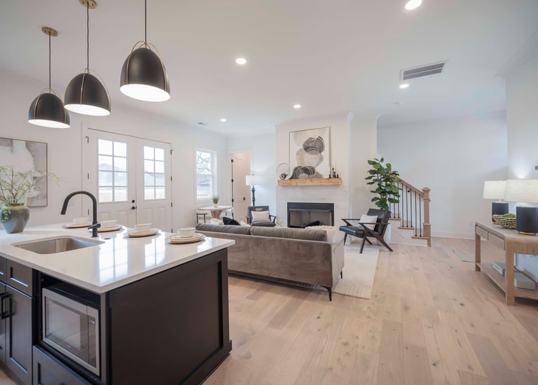 a kitchen with a stove top oven and a sink