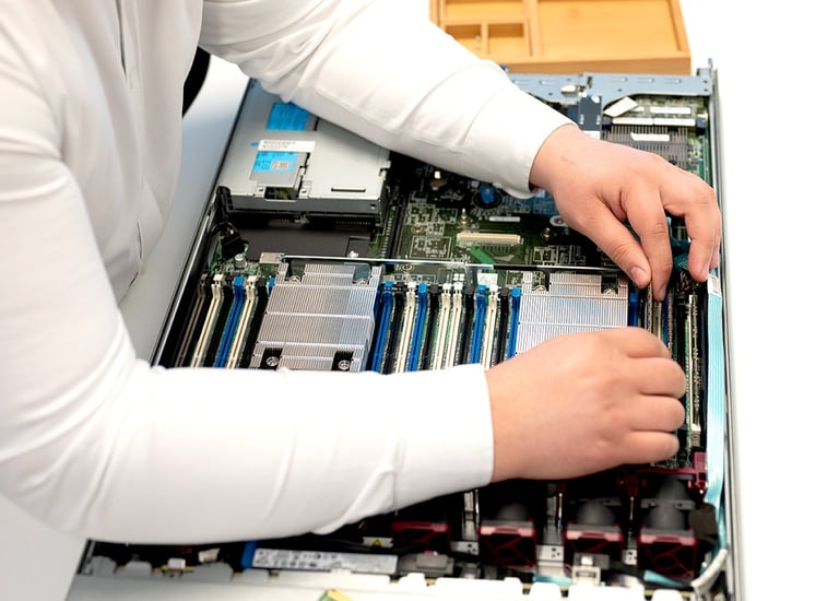a person fixing a computer