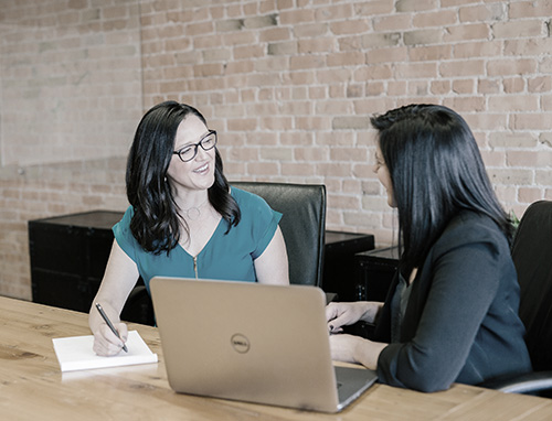 woman giving consultation to another woman