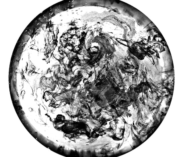 a black and white photo of a circular object