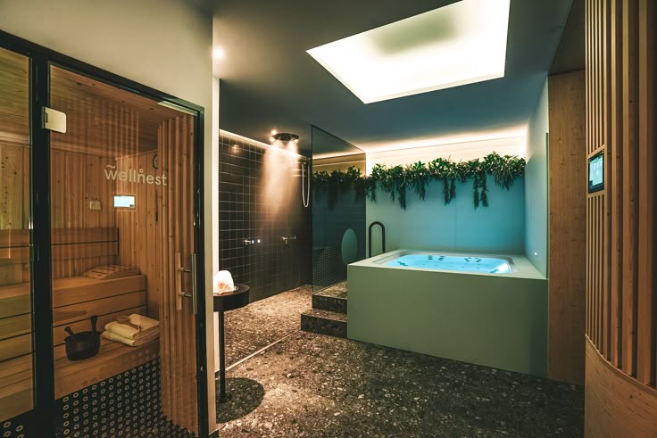 a luxury residential wellness room with sauna, rain shower, and cold plunge pool