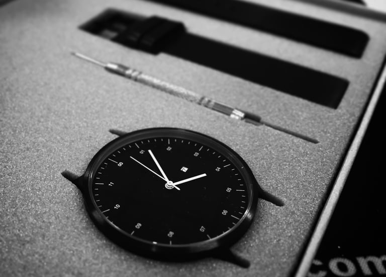 a clock on a box with a watch on it