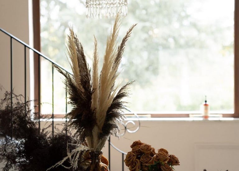 wedding table with a chandelier and flowers