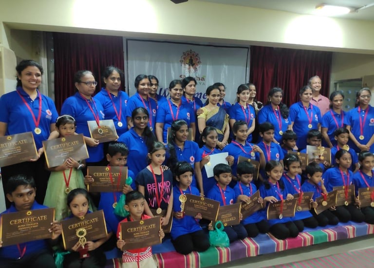 a group of people standing around a group of medals