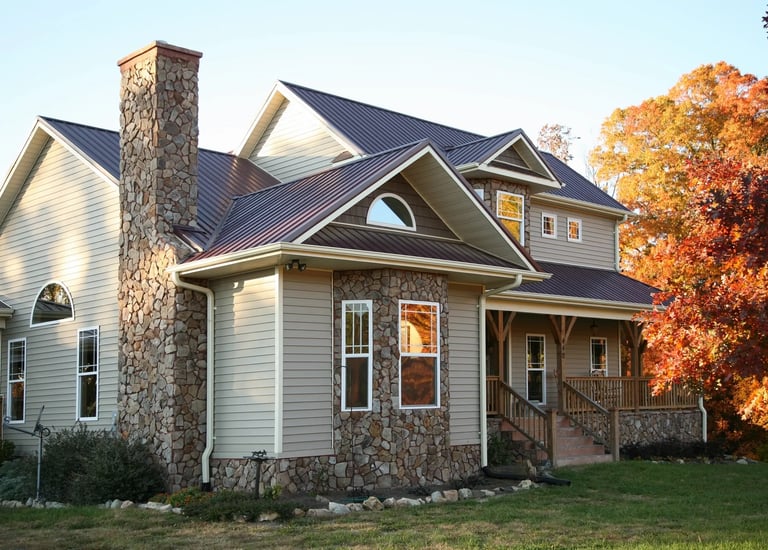 a house with a stone chimney and a chimney