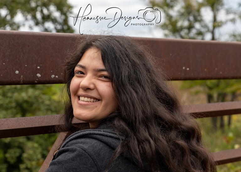 a woman with long hair and a black jacket