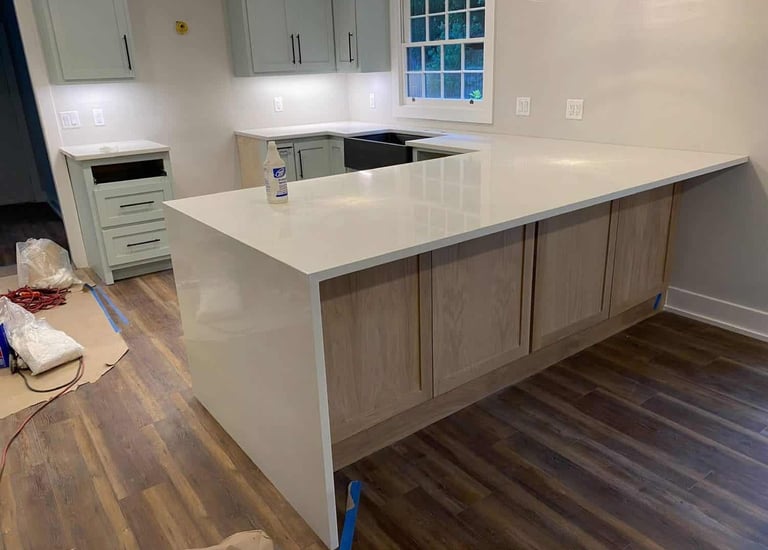 Waterfall countertop design with seamless stone flow