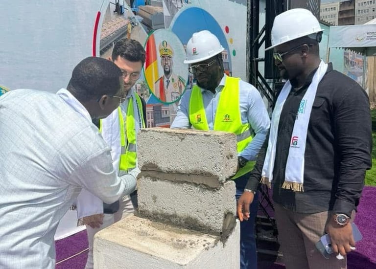 a group of men standing around a cement block