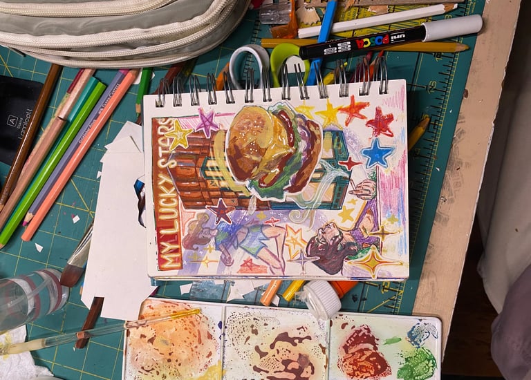 Takara's Artist Workstation—paints, colored pencils & etc.  Painting in progress, "My Lucky Stars"