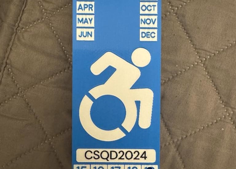 3d printed disability plaque in blue, white and black colors