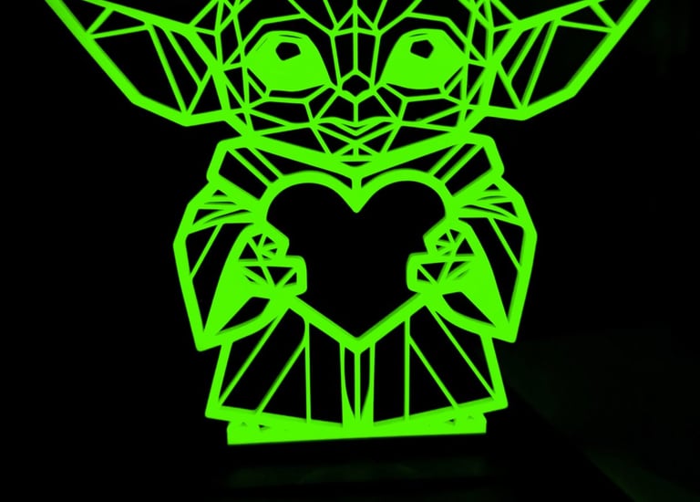 a green glow in the dark 3d printed yoda art statue
